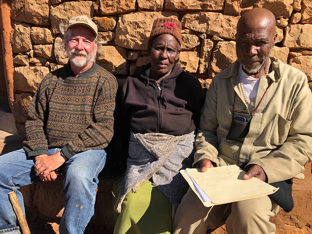 Senqunyane Valley 2019, Ha Melane village chief and his wife receiving photos Bousman took in 1976 of his grandfather.