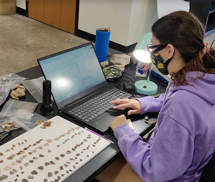 Student analyzing artifacts