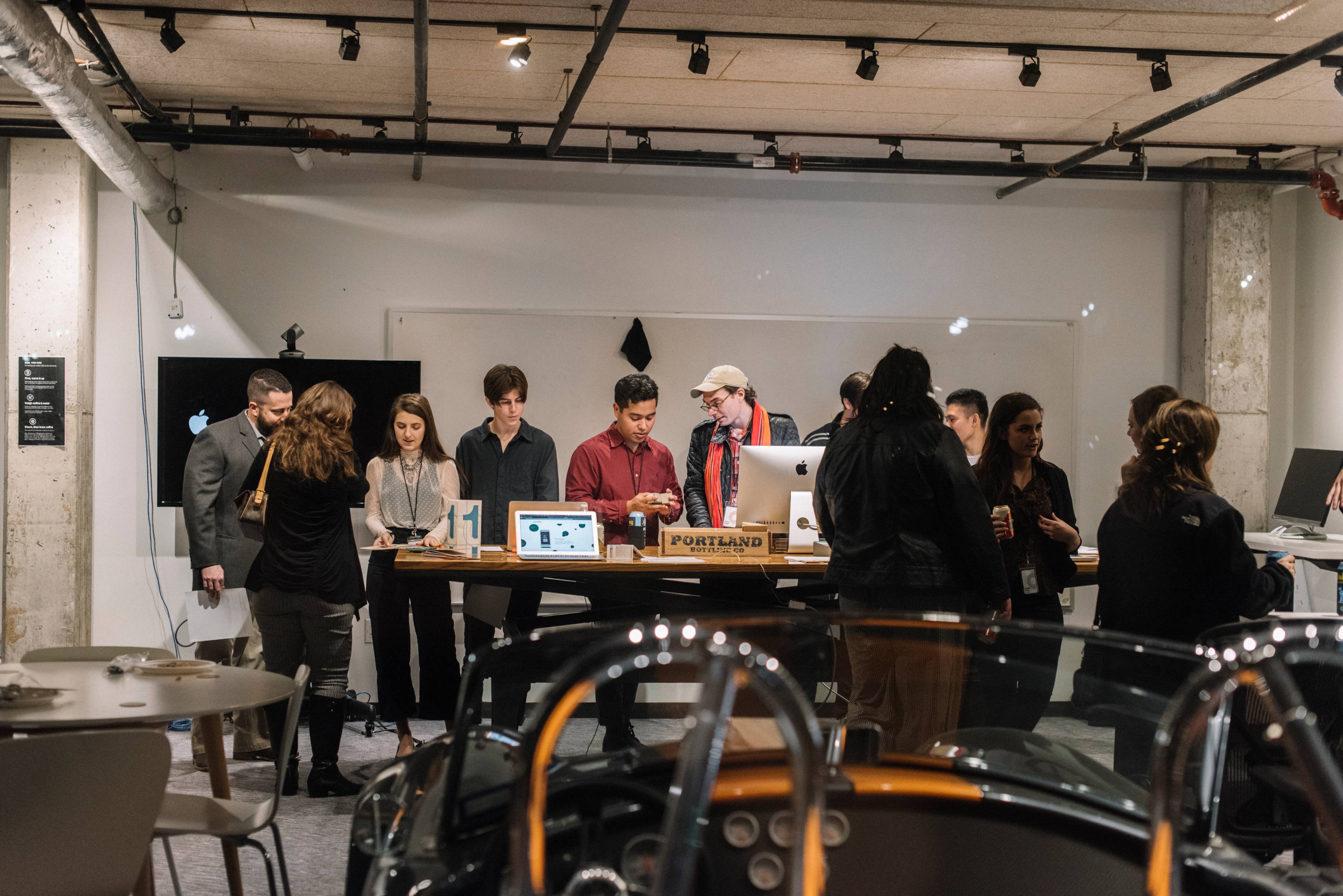 A group of people surrounding a table